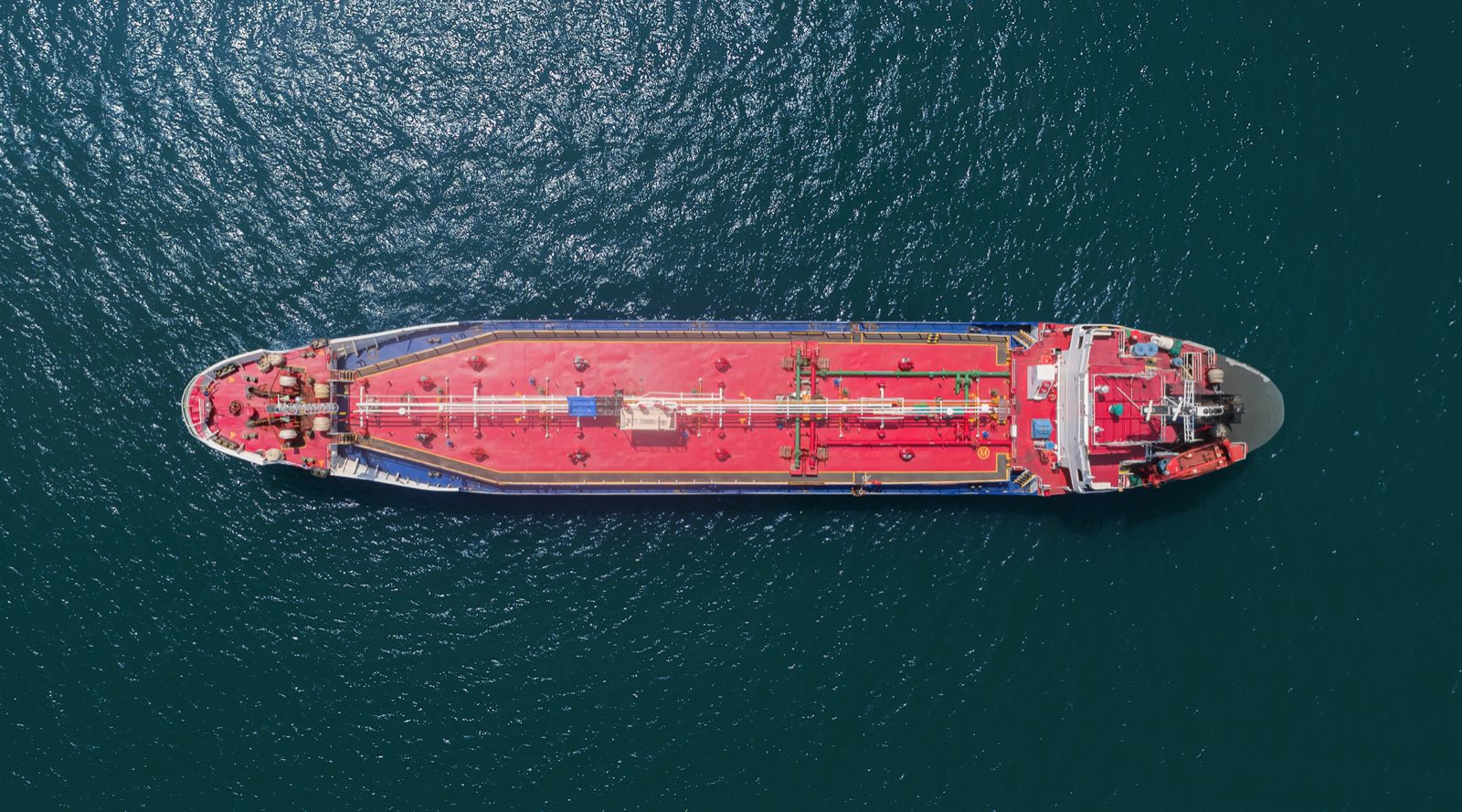 Aerial overhead view of a loaded oil products tanker at sea